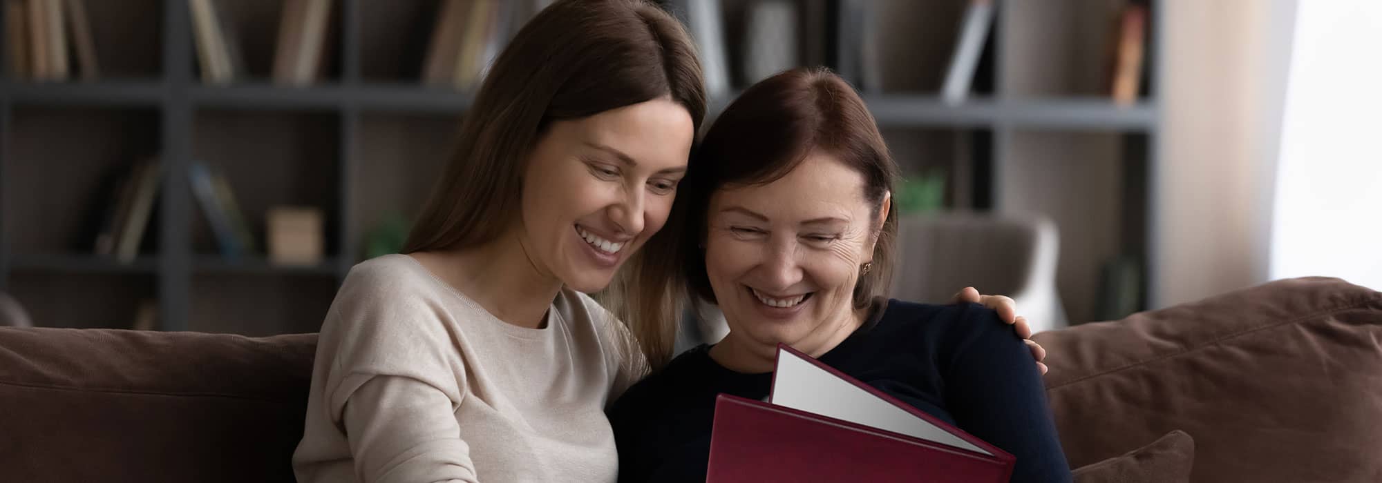 Daughter giving Mother personalised gift showing events for the day she was born